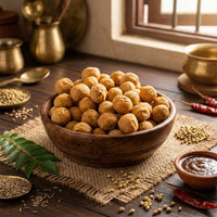 Mini dry masala kachori in wooden bowl with spices, chai chutney and curry leaves