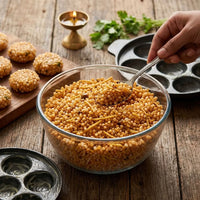 Sabudana khichdi served in a glass bowl with a spoon.